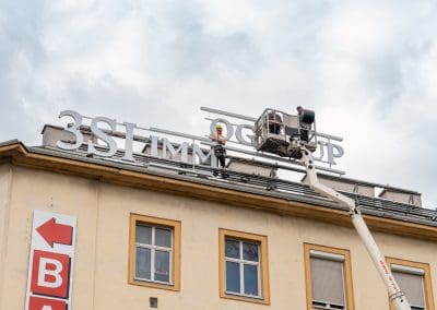 Advertising sign installation above the rooftops of Vienna